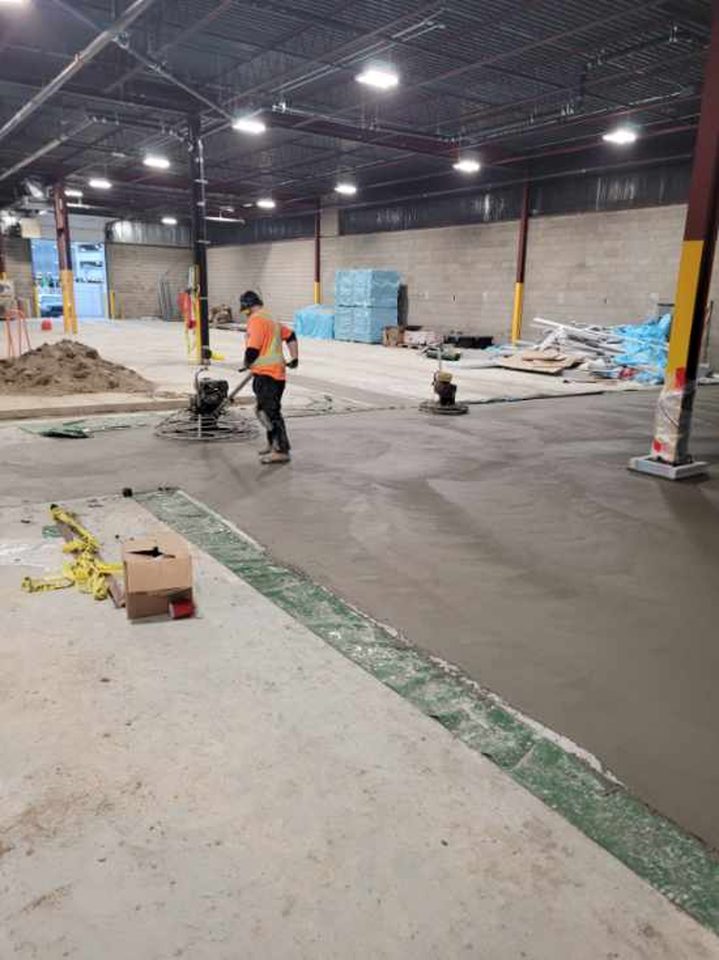 Final trowel finishing of the freezer floor.