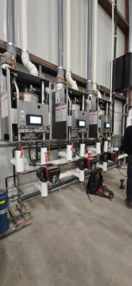 Commissioning of three tankless boilers for underfloor heating system.